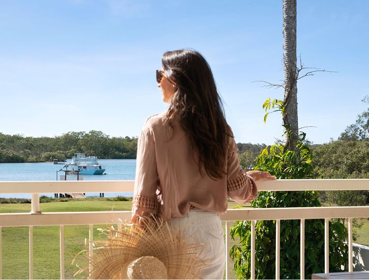 Scenic view looking out over the Noosa River directly from a private guest balcony at Cayman Quays holiday apartments in Noosaville.
