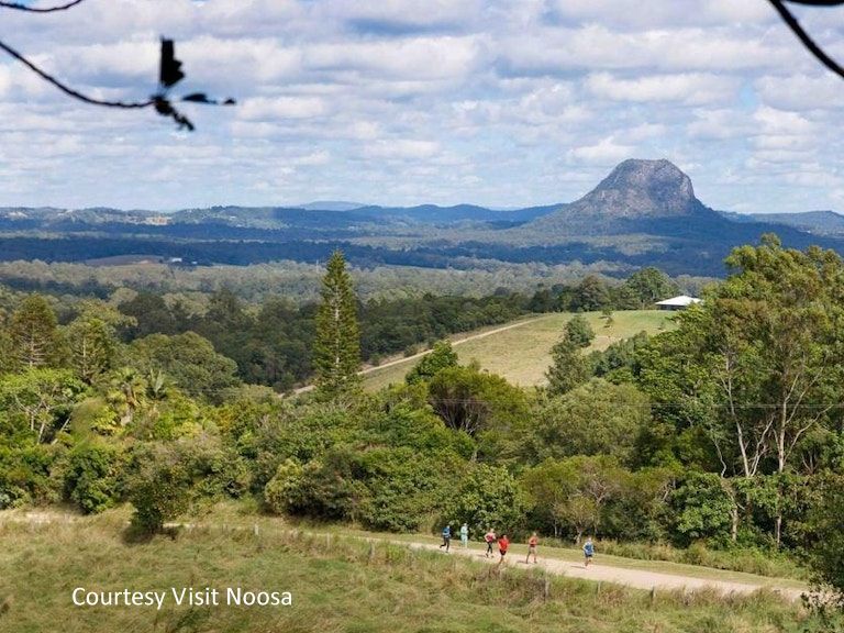A picturesque walking trail in the Noosa Hinterland highlighting beautiful panoramic views of the distant mountain ranges and countryside.